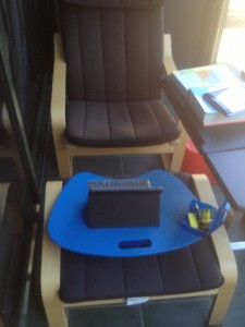 Portable chair and lap desk on balcony